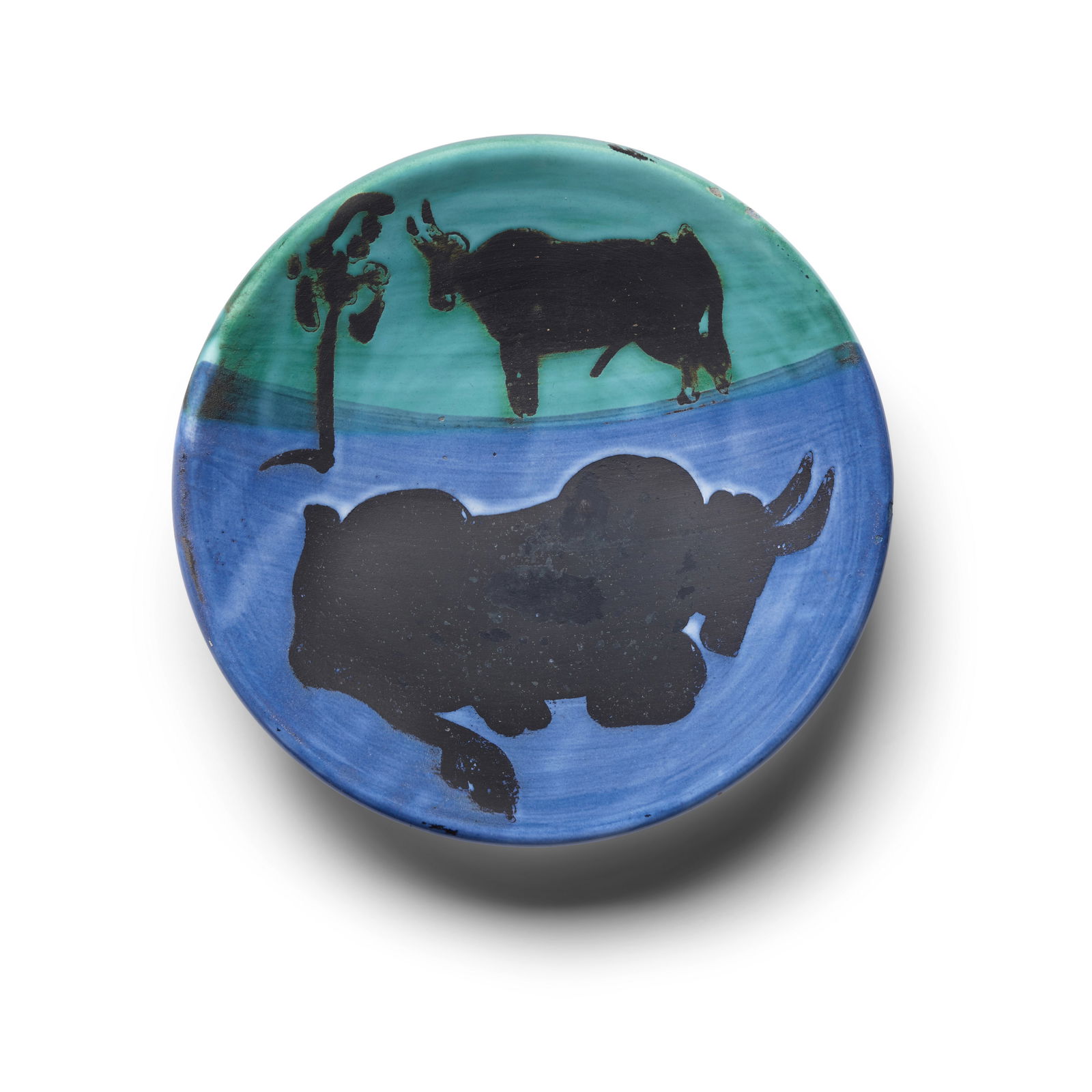 Pablo Picasso (1881-1973); Toros;: Pablo Picasso (1881-1973) Toros (Alain Ramié 161), 1952 Partially glazed white earthenware turned plate, painted in blue, green and black, from the edition of 500, inscribed 'Edition Picasso', wi