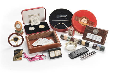 A collection of Sir Roger Moore's desk accessories (qty): A collection of Sir Roger Moore's desk accessories To include: an Asprey travel clock; a Parker Sonnet matte black lacquer fountain pen, with two additional nibs, and further cartridges, in red presen