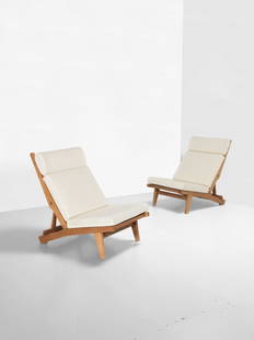 Hans J. Wegner Pair of rare adjustable lounge chairs, circa 1968: Hans J. Wegner Pair of rare adjustable lounge chairs, circa 1968 Oak, fabric upholstery. Each: 90.5 x 61.7 x 100 cm fully reclined Manufactured by AP Stolen, Copenhagen, Denmark. Footnotes: Provenance