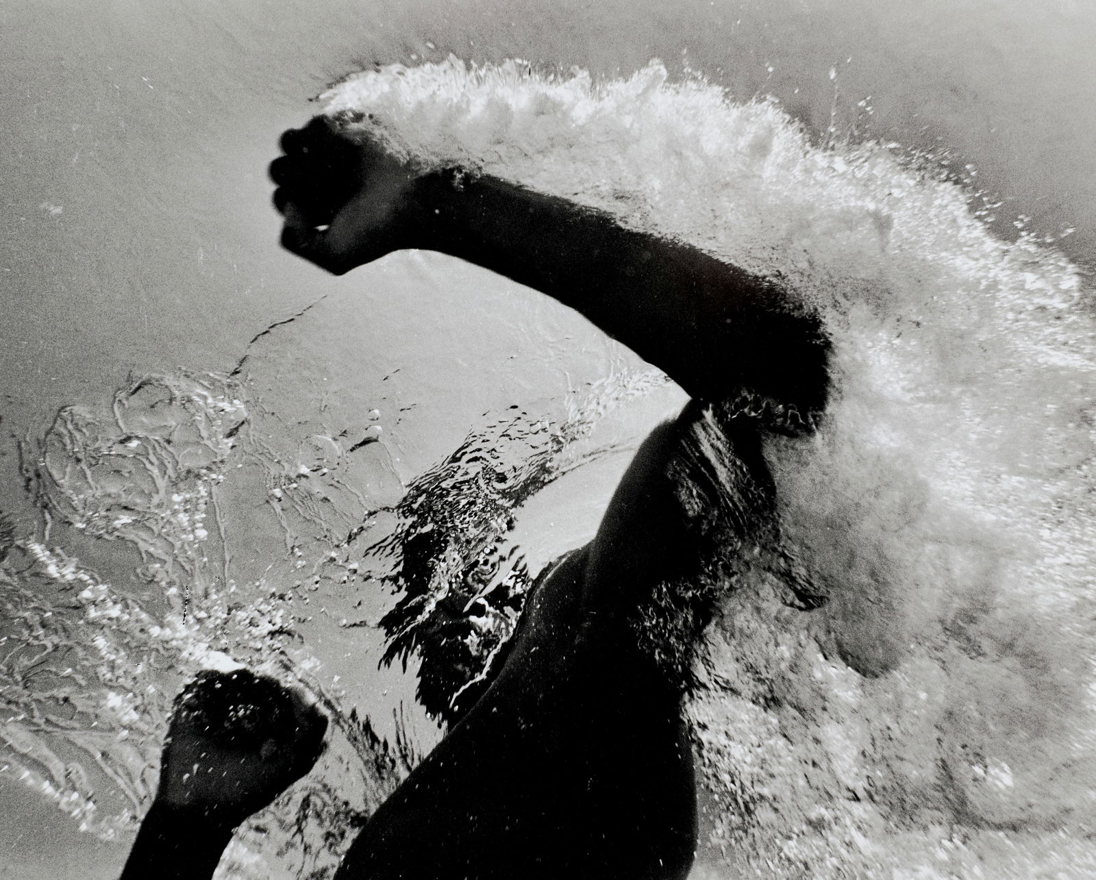 Flip Schulke (1930-2008); Ali Underwater;: Flip Schulke (1930-2008) Ali Underwater, 1961 Gelatin silver print, printed later; signed and annotated in pencil on the reverse. 15 3/8 x 19 3/8 in. (39.1 x 49.2 cm.) sheet 16 x 20 in. (40.6 x 50.8 c