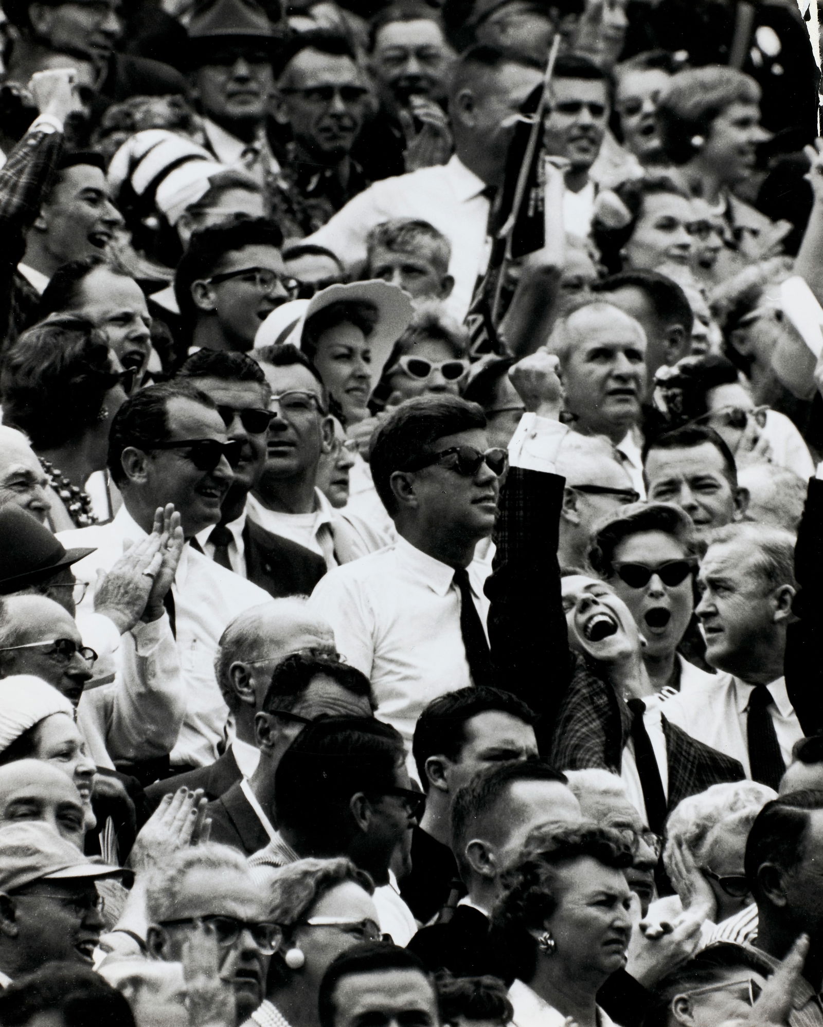 Flip Schulke (1930-2008); President-Elect John F. Kennedy, a Face in the Crowd at the Orange Bow...: Flip Schulke (1930-2008) President-Elect John F. Kennedy, a Face in the Crowd at the Orange Bowl Game, Miami, January 1, 1961 Gelatin silver print; signed in pencil, titled and dated in ink, and the p