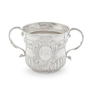 A Queen Anne Britannia standard silver porringer William Andrews, London 1703: A Queen Anne Britannia standard silver porringer William Andrews, London 1703 Of circular waisted form, applied bead s-scroll handles either side, the upper body embossed with a rope-twist girdle, th