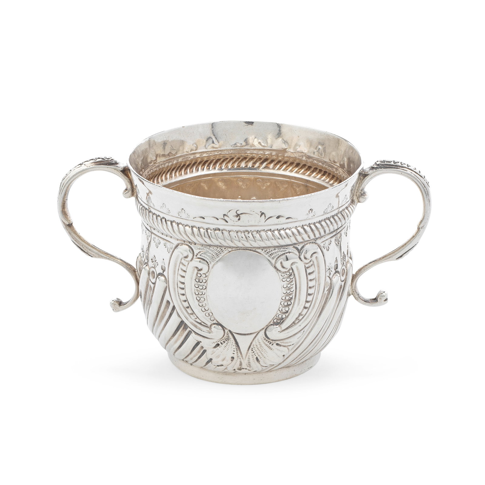 A George I silver two-handled porringer Thomas Mason, London 1719: A George I silver two-handled porringer Thomas Mason, London 1719 Cylindrical form with flared rim, with leaf punch motifs above and below a rope-twist girdle, further leaf and acorn punched motifs ab