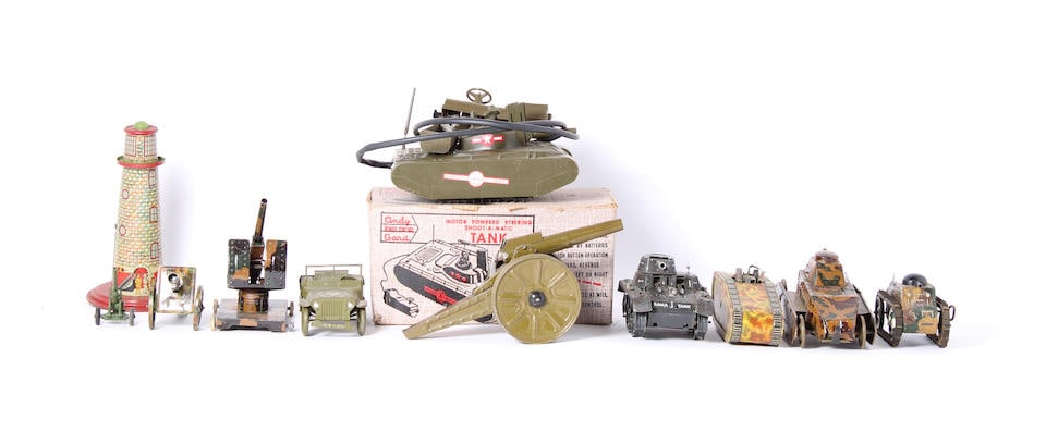 Assorted military vehicles toys and equipment: Assorted military vehicles toys and equipment comprising Andy Gard plastic remote control tank, in original box, four assorted tinplate clockwork tanks, a jeep, two tinplate howitzers, one die cast fi
