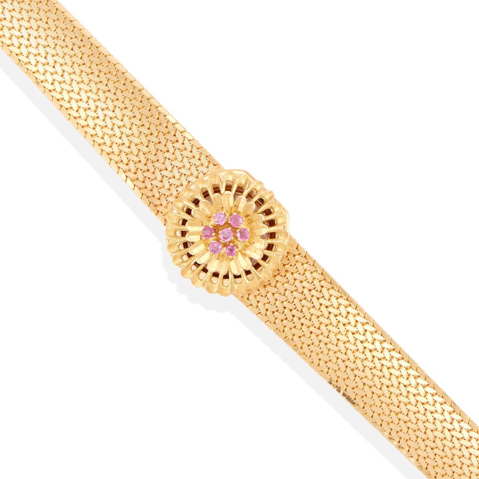 AN 18K GOLD AND RUBY SURPRISE WRISTWATCH (1 of 4)