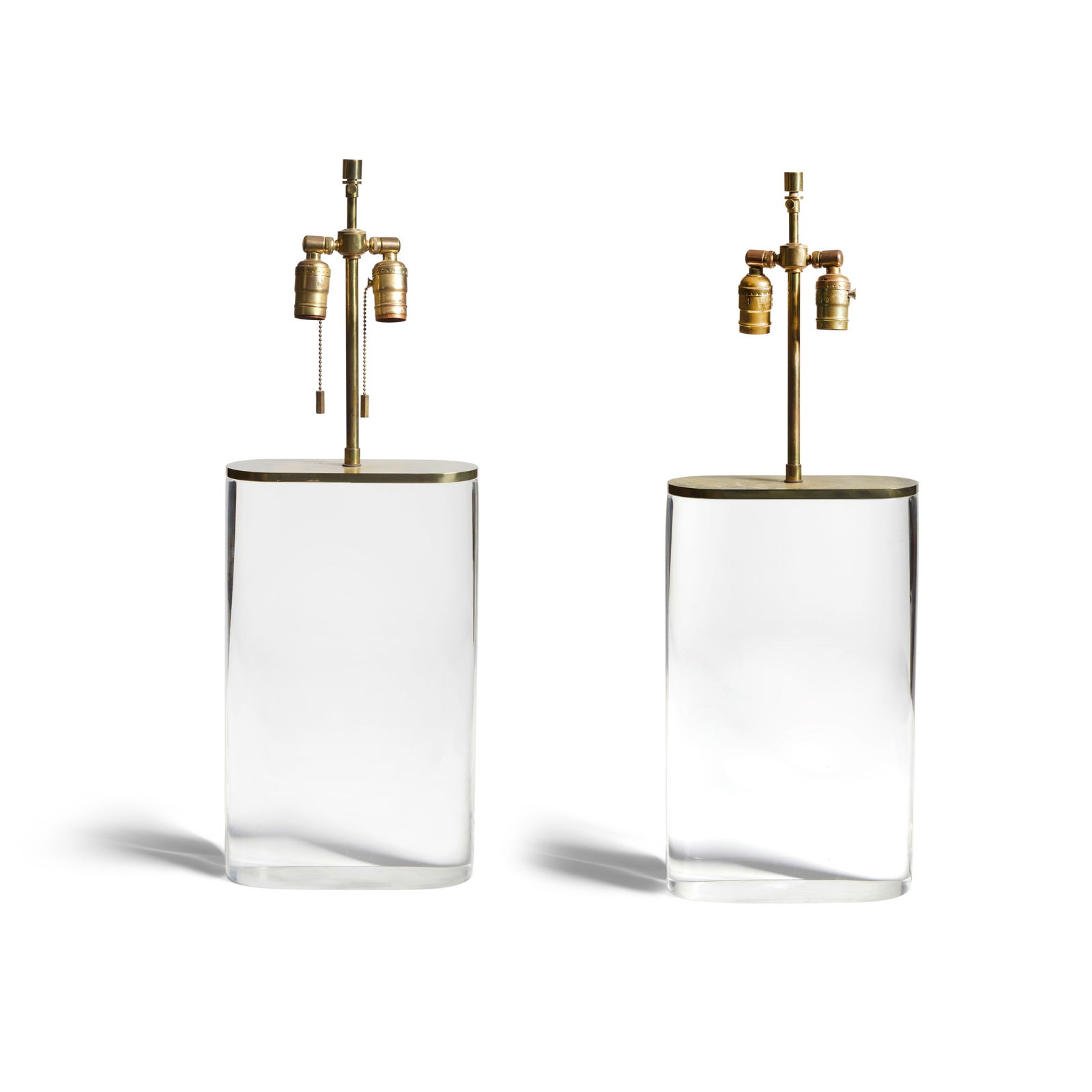 KARL SPRINGER (1931-1991) Pair of Oval Table Lamps1970sacrylic, brassheight 28 3/8in (72.1cm); w... (1 of 3)