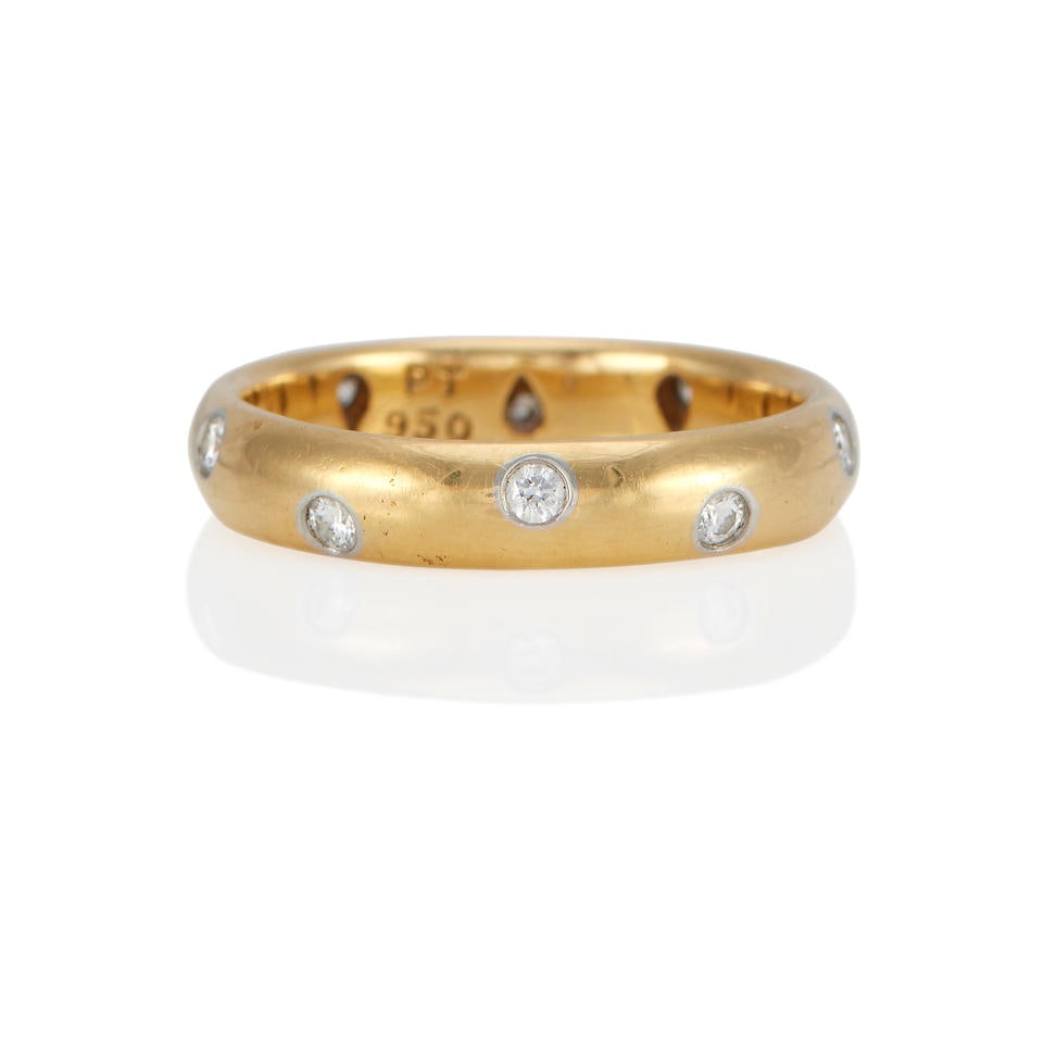 TIFFANY & CO.: AN 18K GOLD AND PLATINUM DIAMOND RING: TIFFANY & CO.: AN 18K GOLD AND PLATINUM DIAMOND RING • 18k yellow gold and platinum • 10 round diamonds • Signed T&Co., with signed box • Size 7 • Estimated gross weight:
