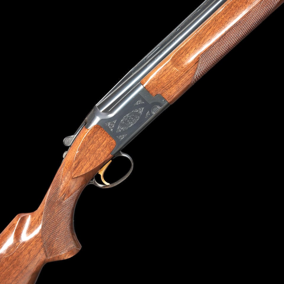 Browning Citori Grade 1 Hunting 12 Gauge Over/Under Shotgun, Modern firearm: Browning Citori Grade 1 Hunting 12 Gauge Over/Under Shotgun, 1984. Serial number 18669PW153, blued steel ventilated rim on a blued steel and foliate scroll engraved frame, checkered walnut stock with