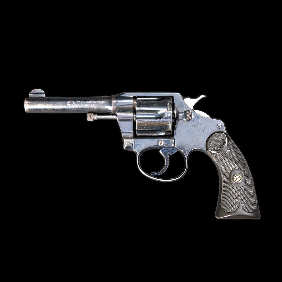 Colt Police Positive .38 Double-action Revolver, Curio or Relic firearm: Colt Police Positive .38 Double-action Revolver, 1912. Serial number 55033, .38 caliber, blued steel barrel and frame with proper roller engraved markings, checkered black hard rubber grips with scrol
