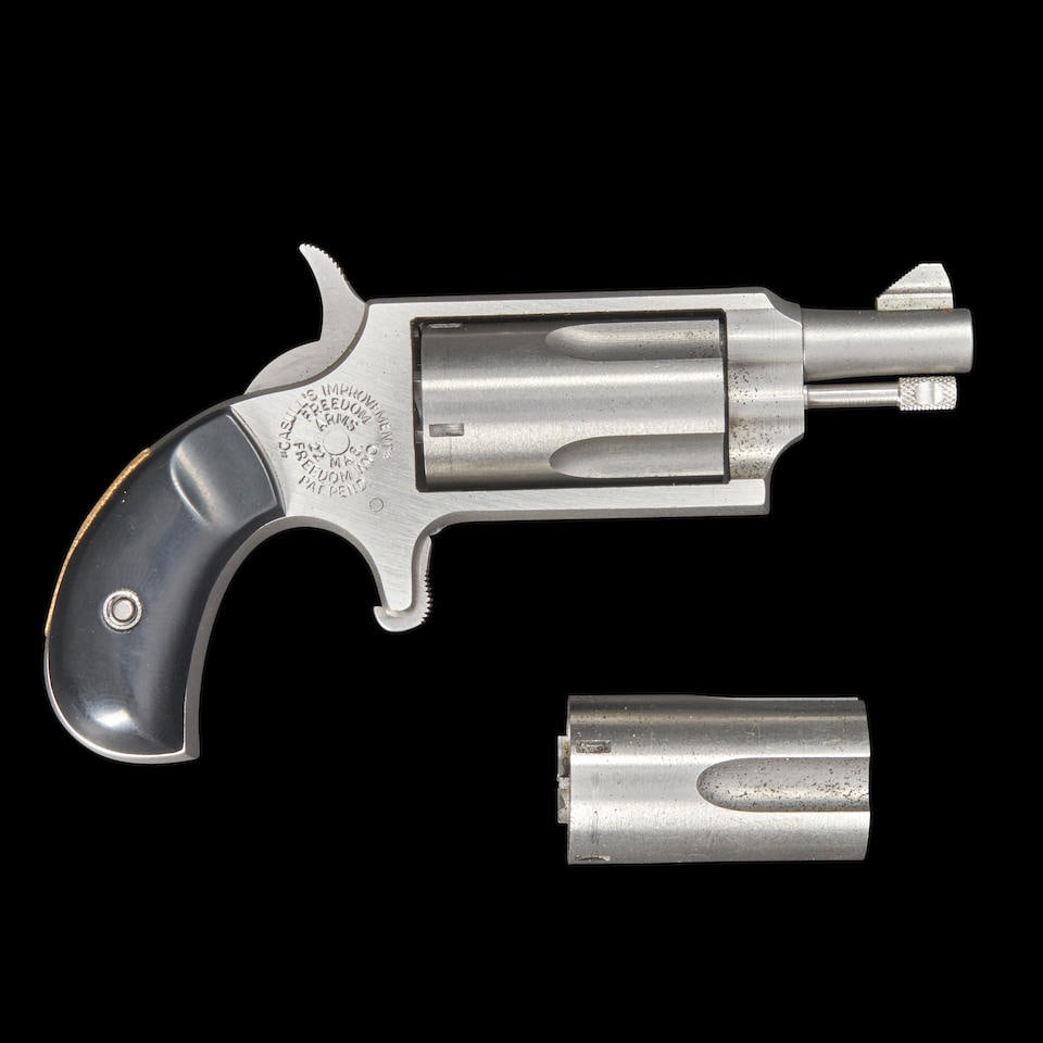 Freedom Arms Ironsides Single-action Revolver, Modern handgun: Freedom Arms Ironsides Single-action Revolver, 1980s. Serial number B25212, .22 Magnum caliber, stainless steel barrel and frame with bird's head grip and black plastic grip panels, with spare four-sh
