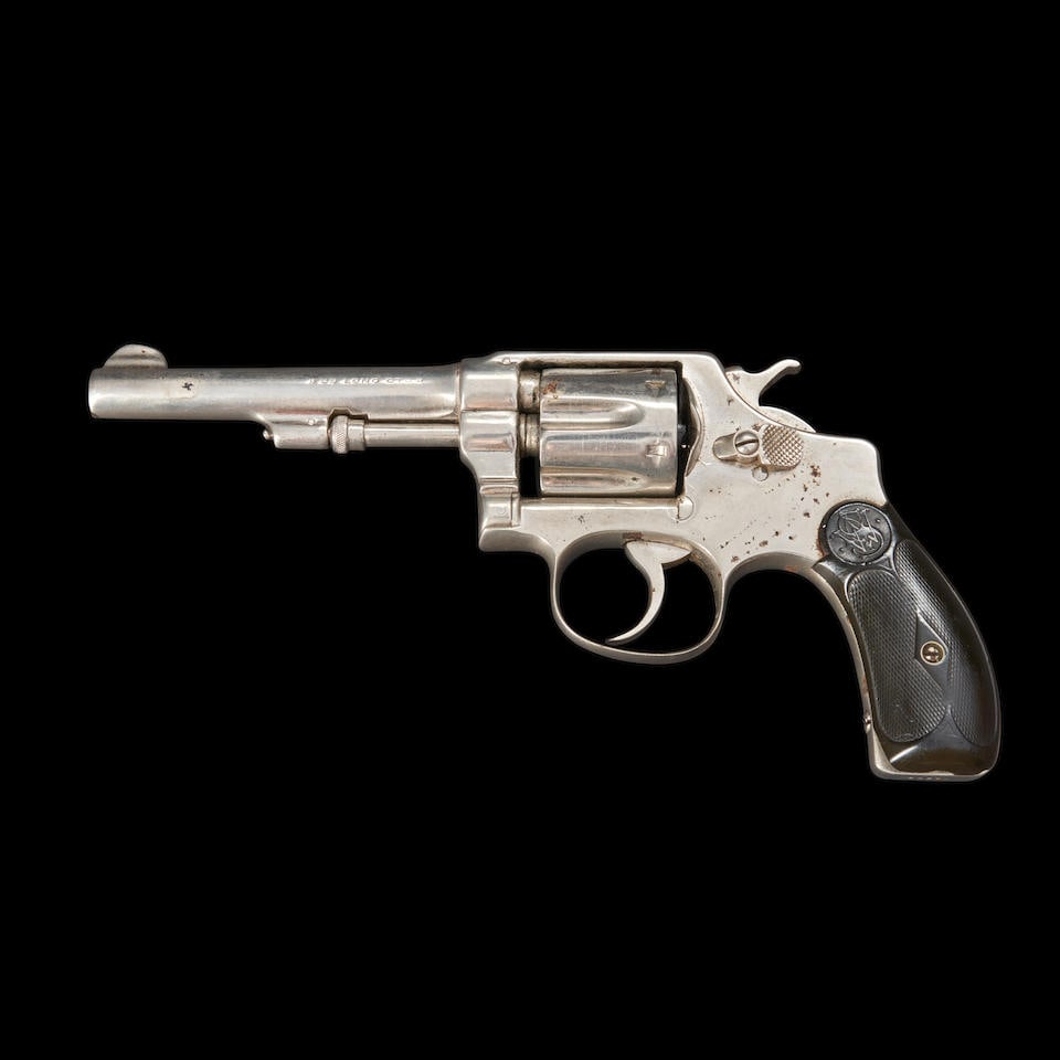 Smith & Wesson .32 Hand Ejector Model of 1903, Curio or Relic firearm: Smith & Wesson .32 Hand Ejector Model of 1903, 1903-04. Serial number 14624, .32 Long caliber, refinished nickel-plated barrel, cylinder and frame, the top of the barrel with four line patent informat