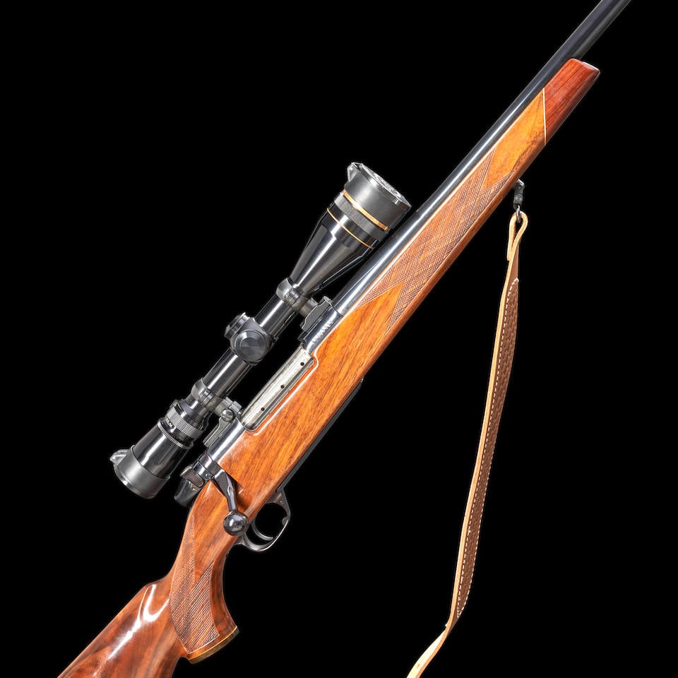 Weatherby Mark V Bolt-action Rifle with Leupold Scope, Modern firearm: Weatherby Mark V Bolt-action Rifle with Leupold Scope, late 20th century. Serial number SB007725, .300 Weatherby Magnum caliber, deep blued and highly polished steel barrel and receiver with proper ro