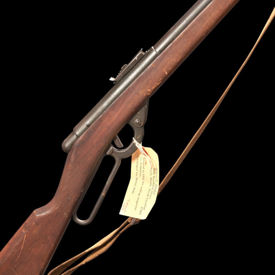 Daisy No. 40 Air Rifle with Sling,: Daisy No. 40 Air Rifle with Sling, Plymouth, Michigan, c. 1920. Barrel with light but legible markings and adjustable rear sight, the muzzle with bracket for mounting a bayonet (missing); stained mapl