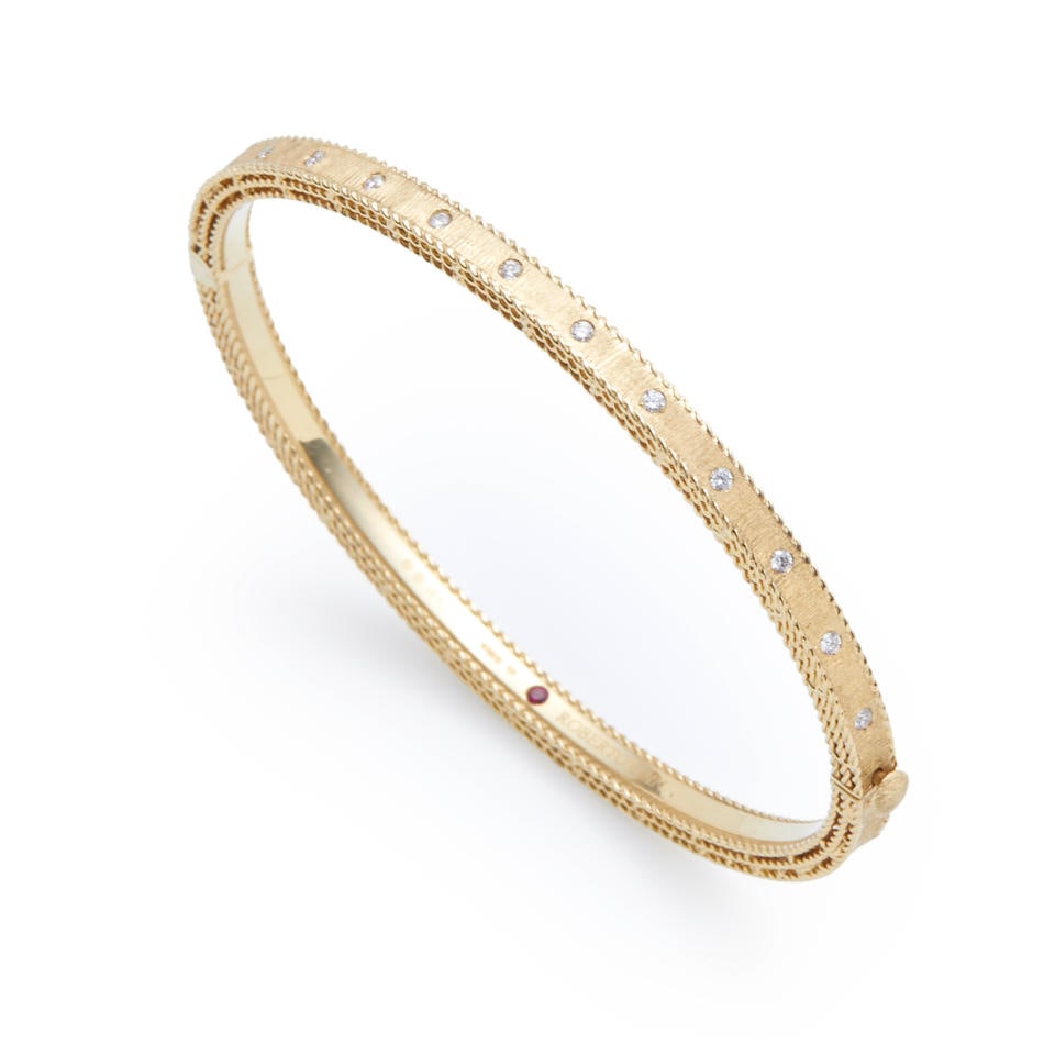ROBERTO COIN: AN 18K GOLD AND DIAMOND BANGLE BRACELET (1 of 3)
