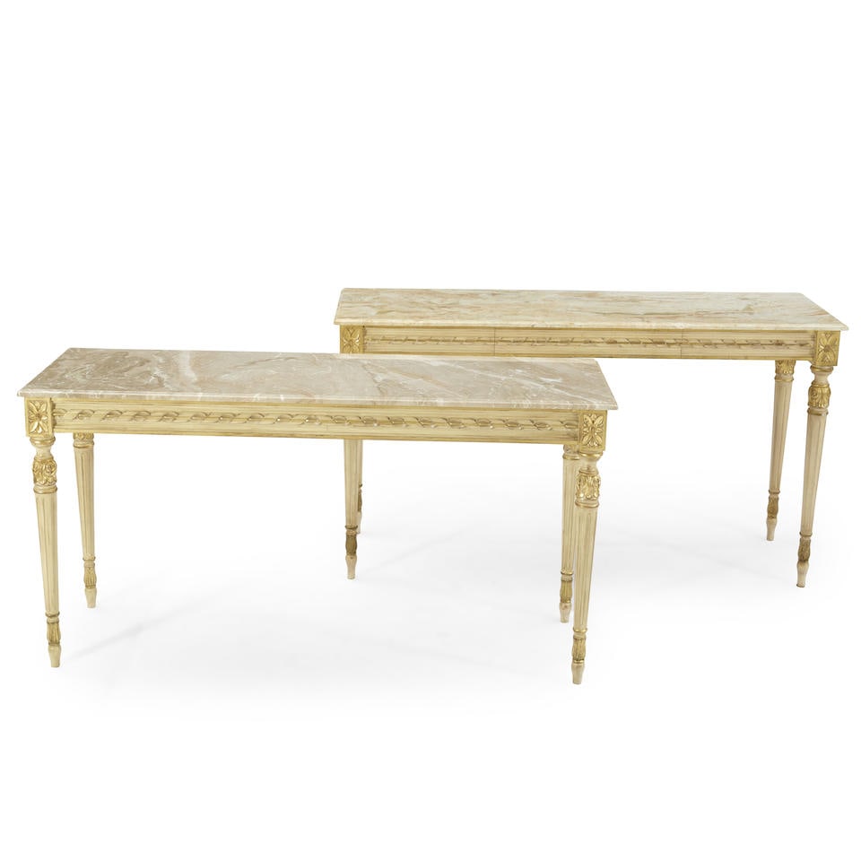 Pair of Similar Marble Top Console Tables, late 20th century,: Pair of Similar Marble Top Console Tables, late 20th century, each gilded and cream painted and set on tapering fluted legs, lg. 60, d. 20, ht. 31, 33 1/4 in. For further information on this lot pleas