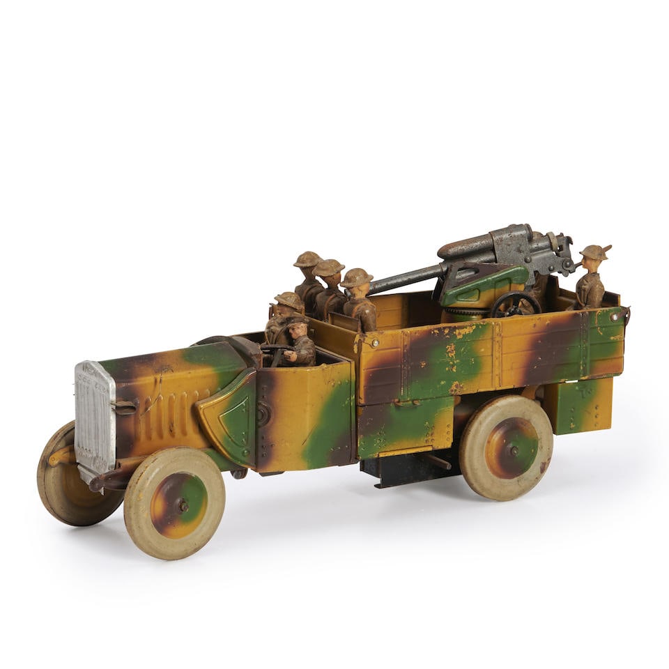Lineol Co. (1906-43), Brandenburg, Germany, Tin Clockwork Model Gun Truck, c. 1940.: Lineol Co. (1906-43), Brandenburg, Germany, Tin Clockwork Model Gun Truck, c. 1940. The camouflage-printed truck with marked grille, open cab, and separate machine gun in flatbed truck, with seven com