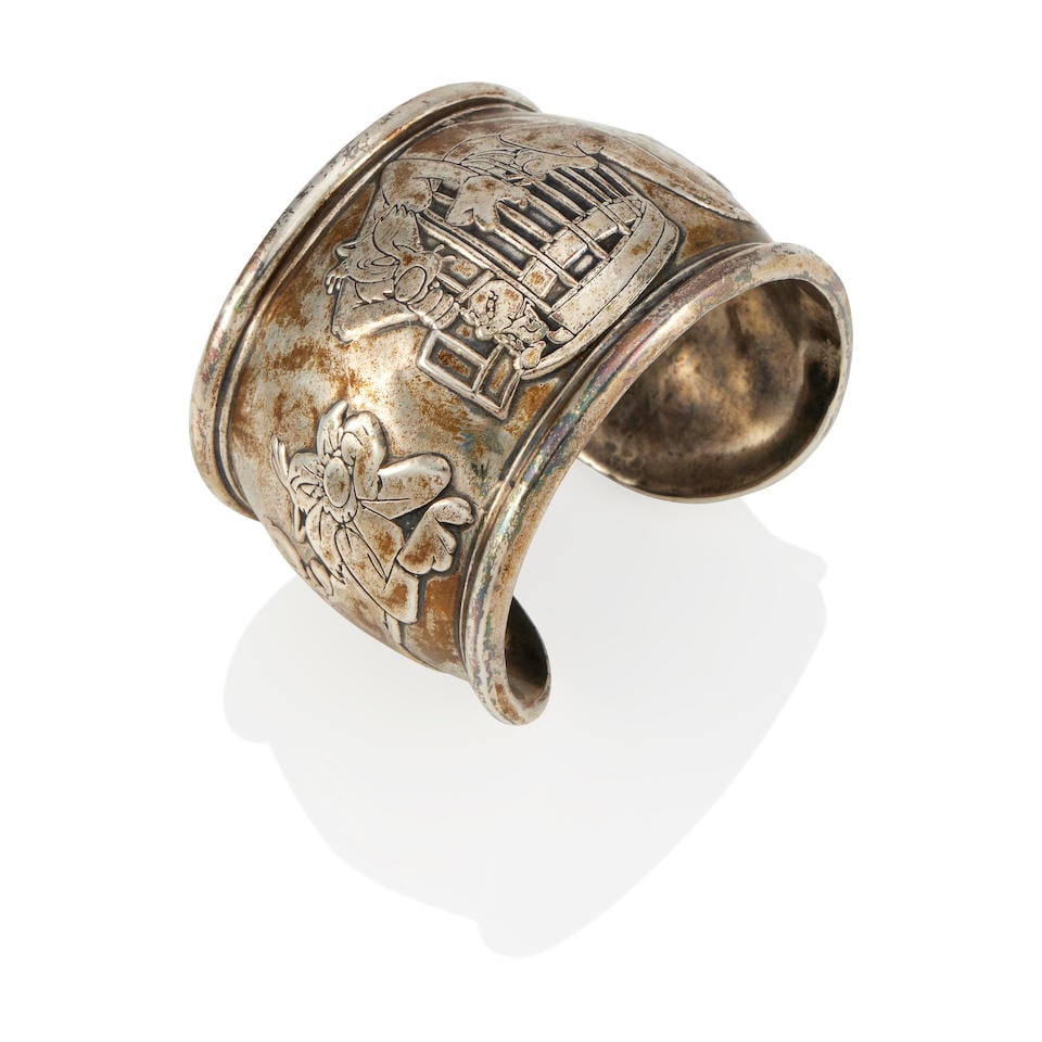 WARNER BROTHERS: A SILVER CUFF BRACELET, ATTRIBUTED TO ROBERT LEE MORRIS: WARNER BROTHERS: A SILVER CUFF BRACELET, ATTRIBUTED TO ROBERT LEE MORRIS • Silver • Signed TM WB • Inner circumference 6 in, gap 7 /8 in, width 1 3/4 in • Estimated gross weigh