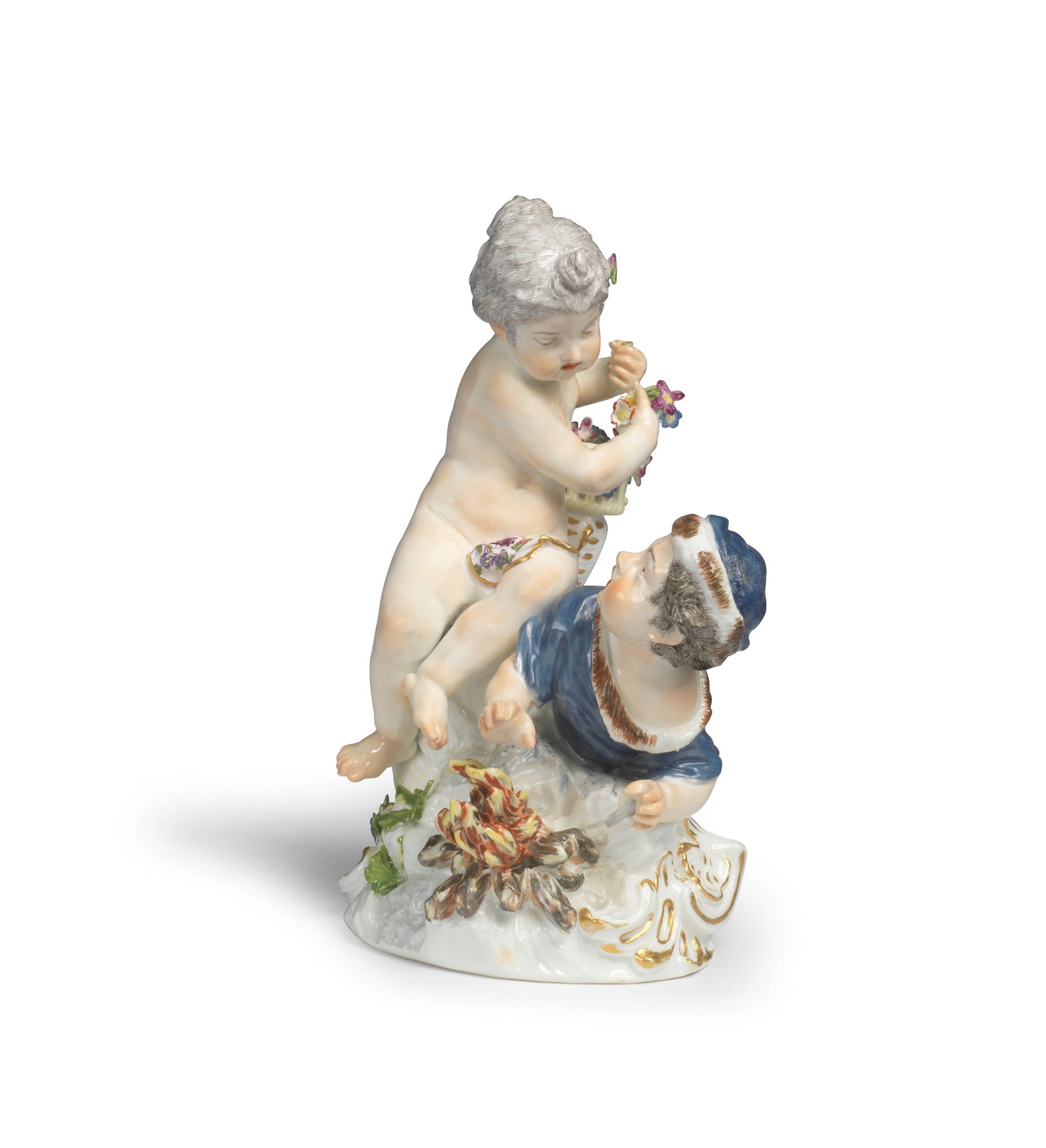 A Meissen group of putti emblematic of Winter and Spring, circa 1755: A Meissen group of putti emblematic of Winter and Spring, circa 1755 Modelled in the round with Winter wearing a fur-lined blue cloak and hat, lying on the base his hands over a fire, Spring seated on