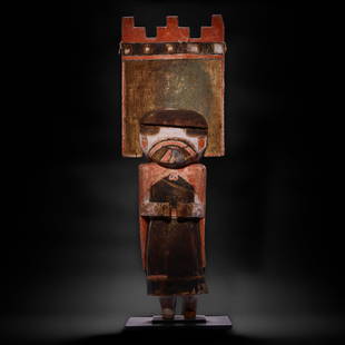 A Hopi katsina doll: A Hopi katsina dollA large example, depicting Palhik Mana or Butterfly maiden, rendered with the typical face paint and wearing a manta and a tall, simple tableta. height 23 1/4in, width 7