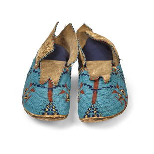 A pair of Tsitsistas/Suhtai (Cheyenne) or Inunaina (Arapaho) beaded moccasins: A pair of Tsitsistas/Suhtai (Cheyenne) or Inunaina (Arapaho) beaded moccasins Likely of buffalo hide construction, worked with stepped chevrons, stacked diamonds, and additional geometric elements acr