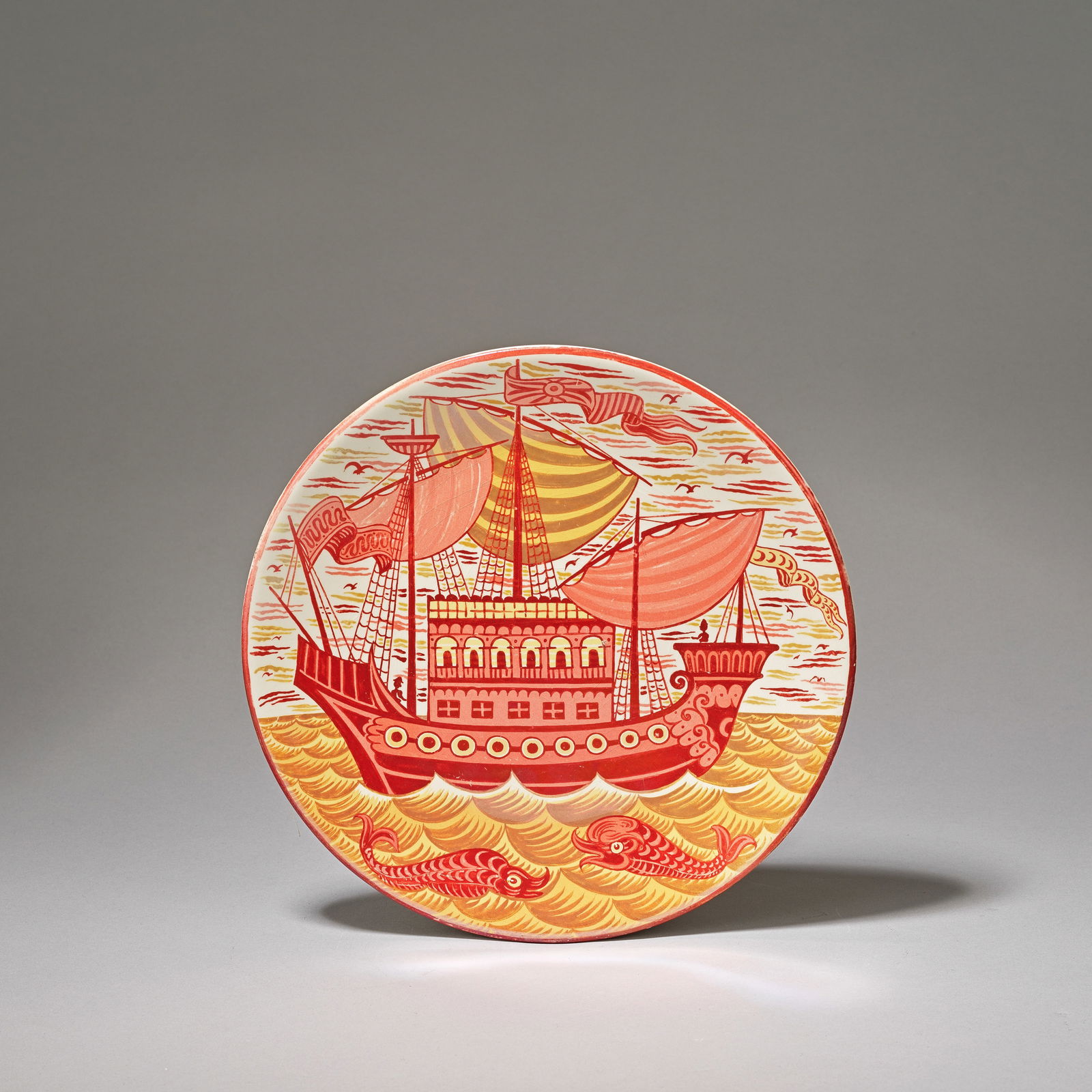 WILLIAM DE MORGAN (BRITISH, 1839-1917) 'Galleon' charger, circa 1890: WILLIAM DE MORGAN (BRITISH, 1839-1917)'Galleon' charger, circa 1890Earthenware, ruby and gold lustre glazes. Galleon with three sails, central elaborate above deck cabin/fortress and two large fish be