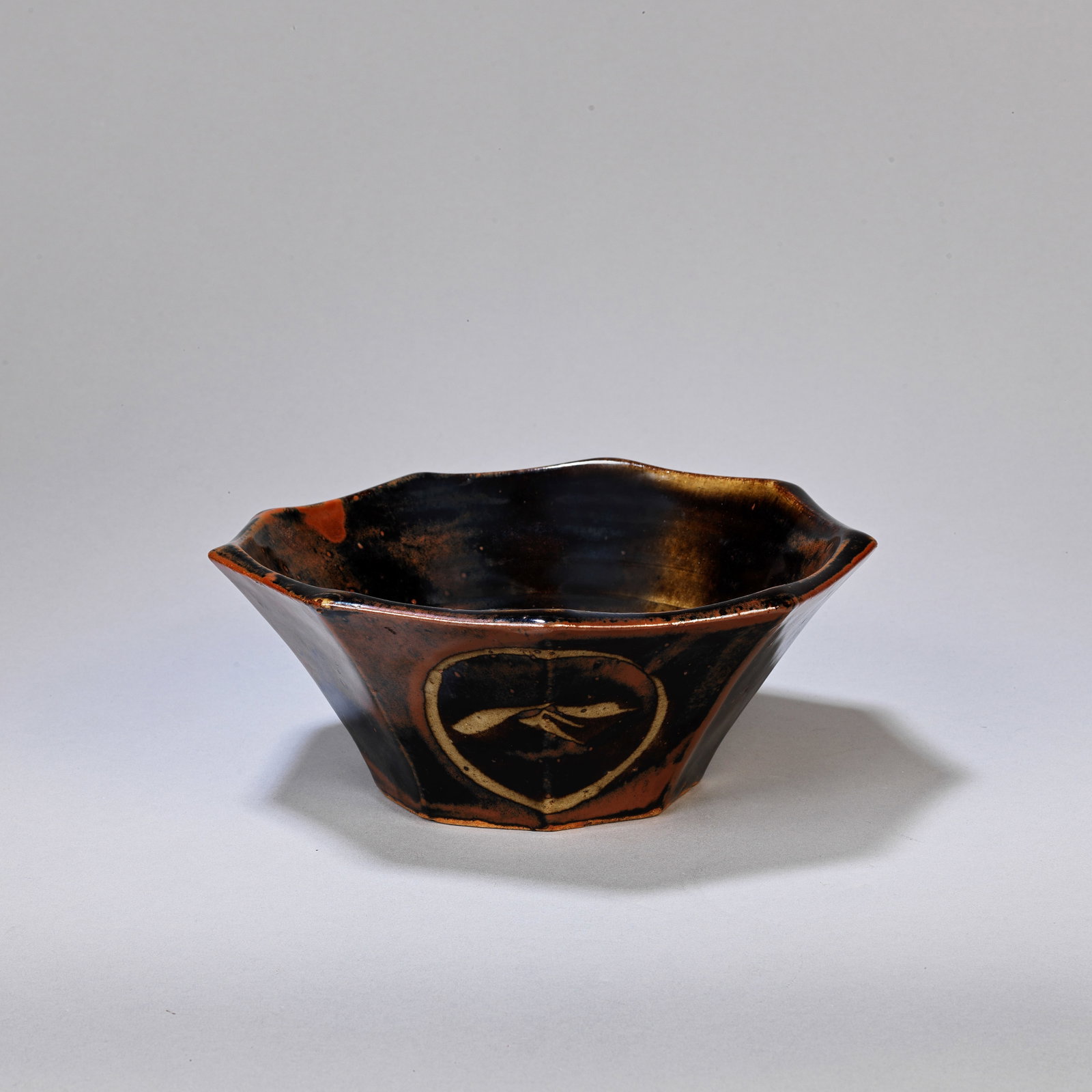 KANJIRŌ KAWAI (JAPANESE, 1890-1966) Bowl, circa 1935: KANJIRŌ KAWAI (JAPANESE, 1890-1966)Bowl, circa 1935Stoneware, layered iron over tenmoku glazes.9 x 22 x 22 cm