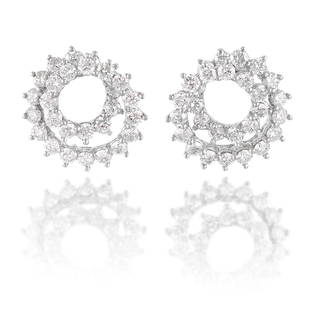 ATTRIBUTED TO ANGELA CUMMINGS FOR TIFFANY & CO.: A PAIR OF DIAMOND EARRINGS: ATTRIBUTED TO ANGELA CUMMINGS FOR TIFFANY & CO.: A PAIR OF DIAMOND EARRINGS Each designed as a spiral of round brilliant-cut diamonds; signed Tiffany & Co.; estimated total diamond weight 1.75 carats;