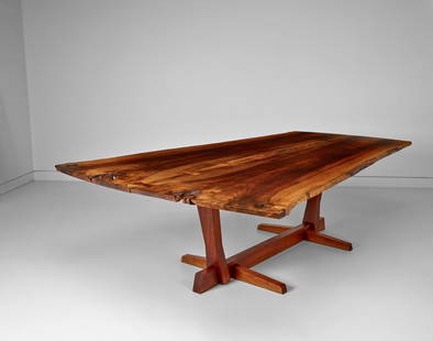 GEORGE NAKASHIMA (1905-1990) Important Conoid Dining Table1969two Persian walnut boards joined ...: GEORGE NAKASHIMA (1905-1990) Important Conoid Dining Table 1969 two Persian walnut boards joined by five butterfly joints with open fissures and two free edges, American black walnut, signed 'Garrett'