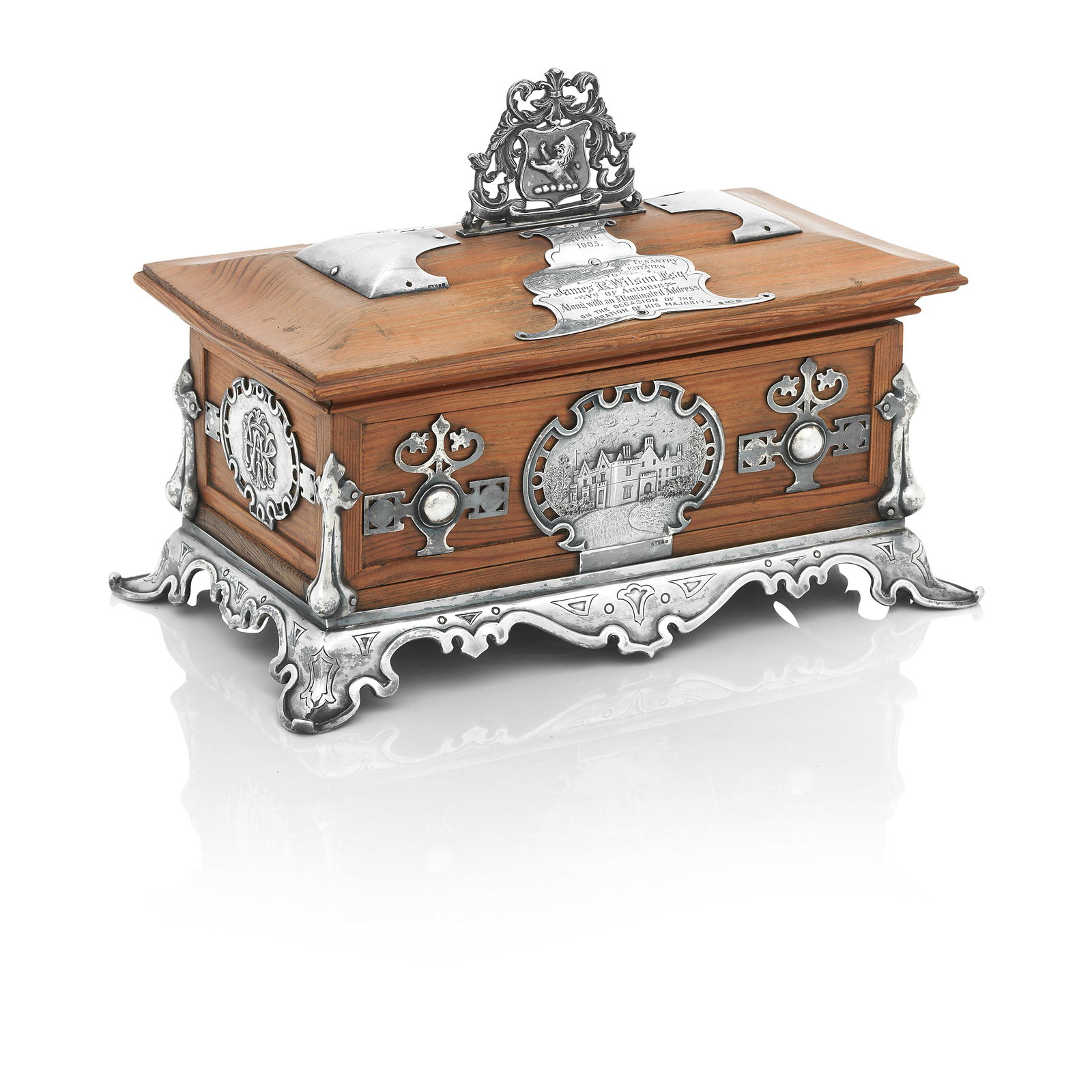 An Edwardian Silver-Mounted Wooden Presentation Casket By John Alexander Fettes, Glasgow, 1904: An Edwardian Silver-Mounted Wooden Presentation CasketBy John Alexander Fettes, Glasgow, 1904 On four silver feet and with a scrolling apron, the sides applied with a plaque depicting a house, another