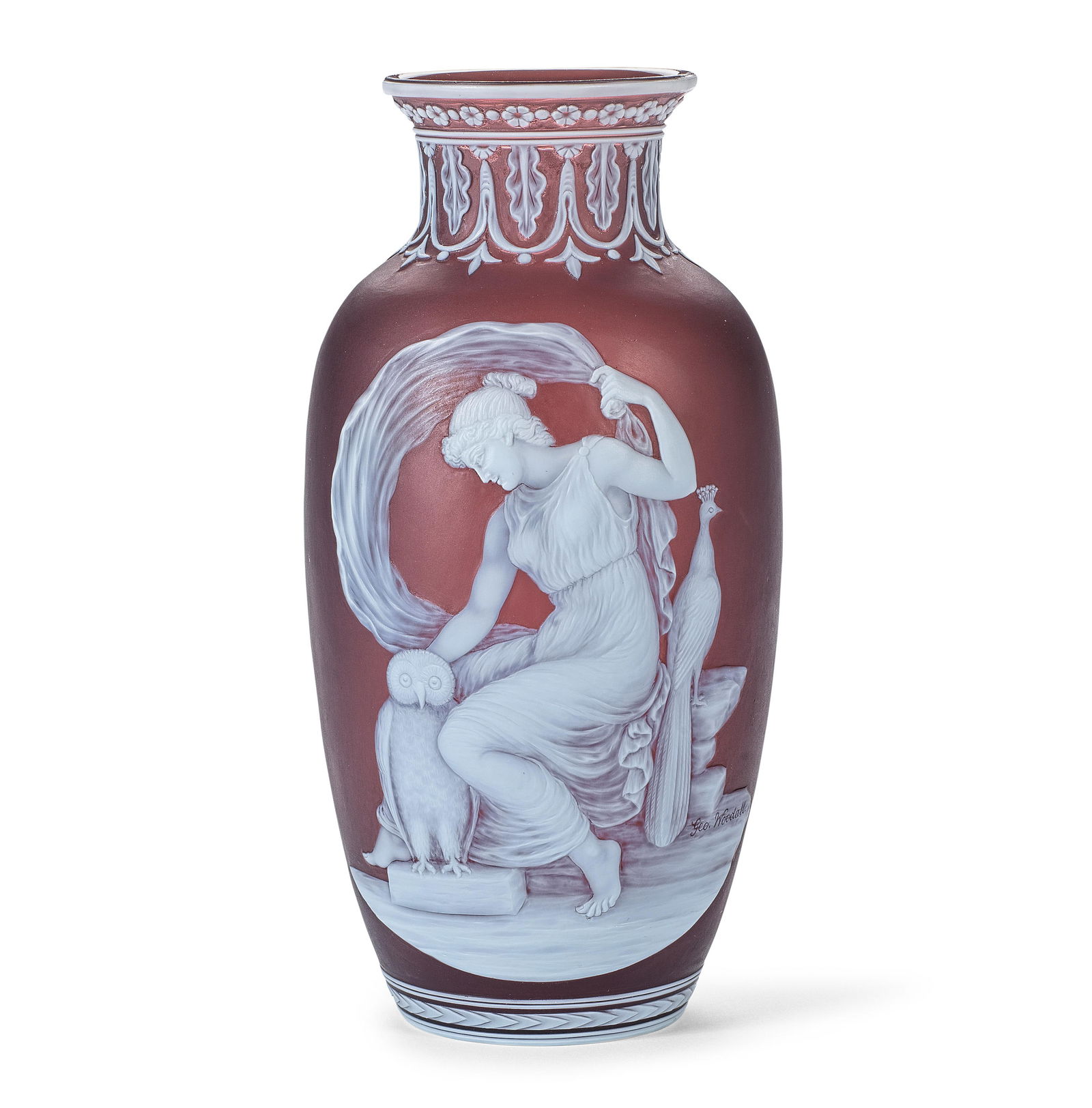 Juno: an important Thomas Webb and Sons cameo glass vase by George Woodall, circa 1895-1900: Juno: an important Thomas Webb and Sons cameo glass vase by George Woodall, circa 1895-1900In translucent brown glass overlaid in opaque white, the slender ovoid form finely carved with a Classical sc