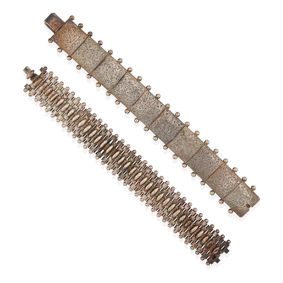 TWO SILVER LINK BRACELETS: TWO SILVER LINK BRACELETS • Silver • Length 7 1/2 in. • Estimated gross weight: 77.3 grams Footnotes: OVERALL CONDITION: Metal stamped and tested for 14k gold; clasp and safety secu