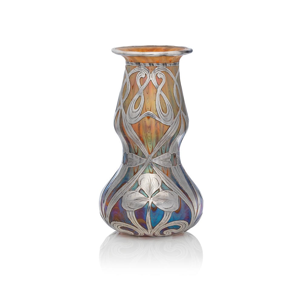 Loetz 'Phänomen' vase, shape no. 180, circa 1900: Loetz 'Phänomen' vase, shape no. 180, circa 1900 Blown glass with feathered iridescence, with sterling silver overlay. 13.5 cm high, 8 cm diameter Etched marks to the base Loetz Austria and stamp