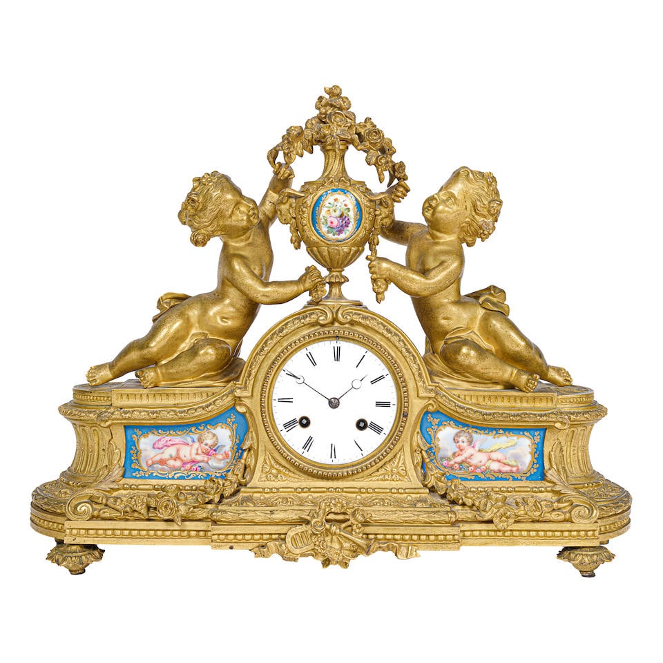 A LOUIS XVI STYLE PORCELAIN INSET GILT BRONZE FIGURAL MANTEL CLOCKLate 19th/early 20th century (1 of 1)