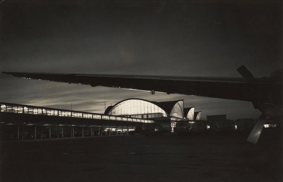 W. Eugene Smith (1918-1978); Lambert St. Louis Airport;: W. Eugene Smith (1918-1978) Lambert St. Louis Airport, c. 1956 Gelatin silver print, printed before 1978; mounted, annotated in pencil and the photographer's Estate stamp on the reverse, framed. 5 3/4