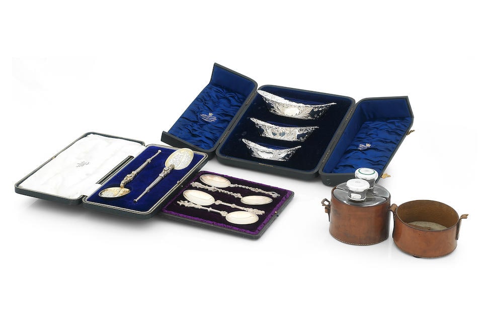 A Collection of Cased Silver Items,: A Collection of Cased Silver Items, Comprising a pair of glass flasks with silver and enamel caps marked 'W & L', a set of three graduated oval dishes, James Dixon, Sheffield, 1900, a pair of silver