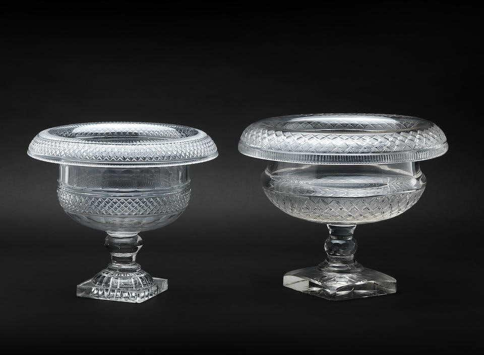 A Regency Irish Cut-Glass Bowl One circa 1820: A Regency Irish Cut-Glass Bowl One circa 1820 The first on square 'lemon squeezer' foot, cut with bands of relief diamonds and with turnover rim, 21cm high, the second of similar form but of early 20t