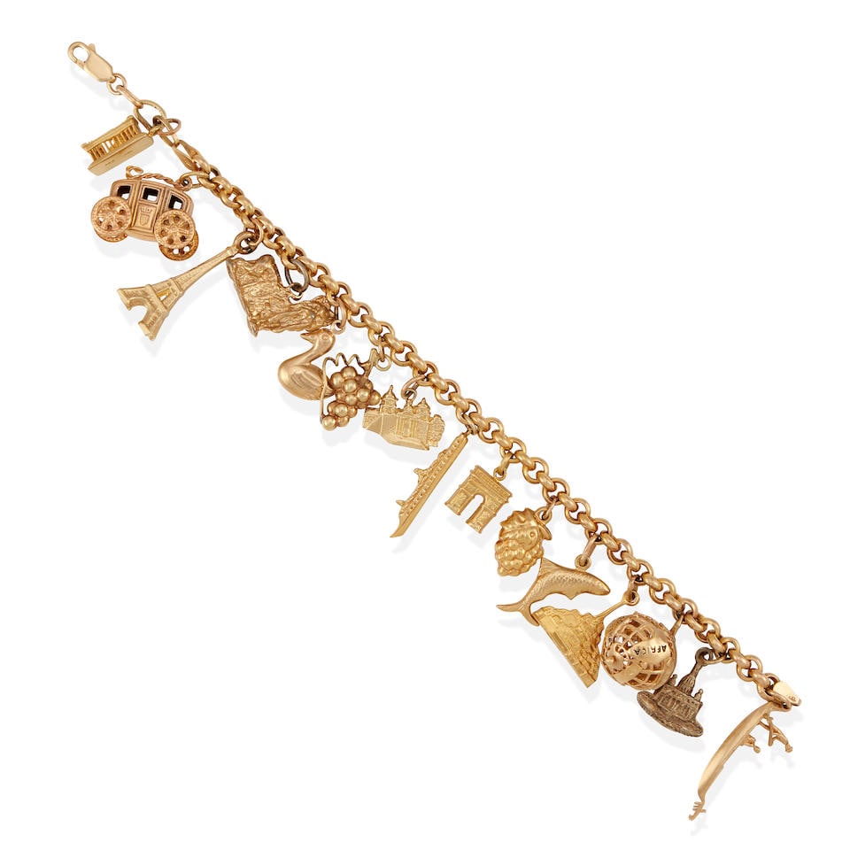 A GOLD AND METAL CHARM BRACELET (1 of 2)