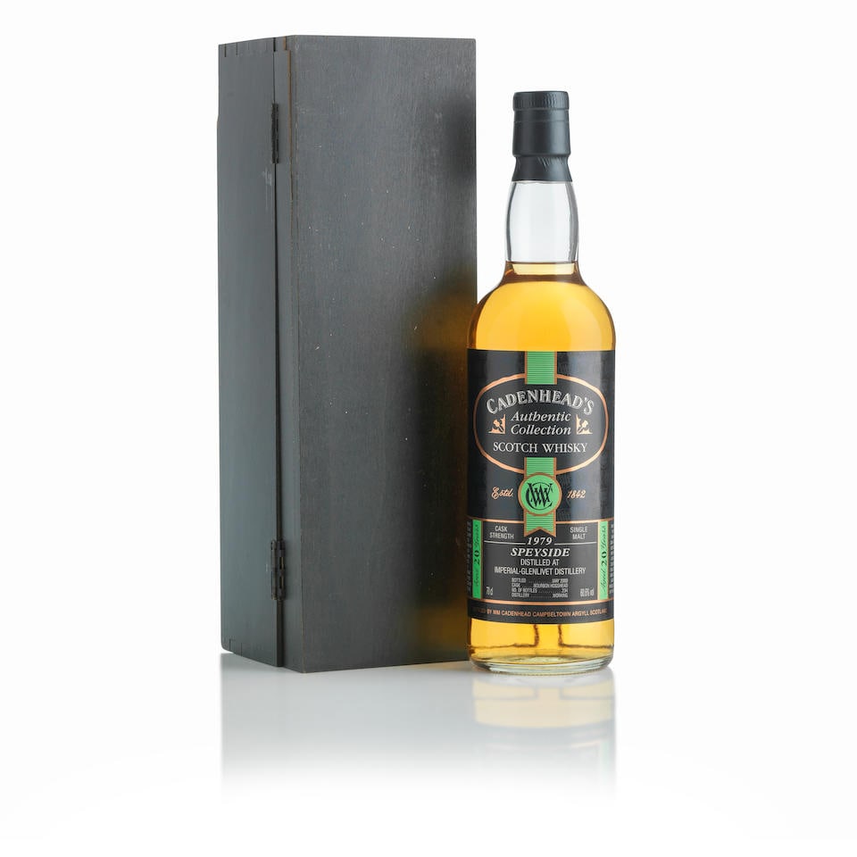 Imperial 20 Year Old 1979 Cadenhead (1): Imperial 20 Year Old 1979 Cadenhead (1) Bottled May 2000. Bottled by Wm. Cadenhead. Bourbon Hogshead Cask. One of 230 bottles. In original wooden presentation case (damages). Good labelling. Level: in