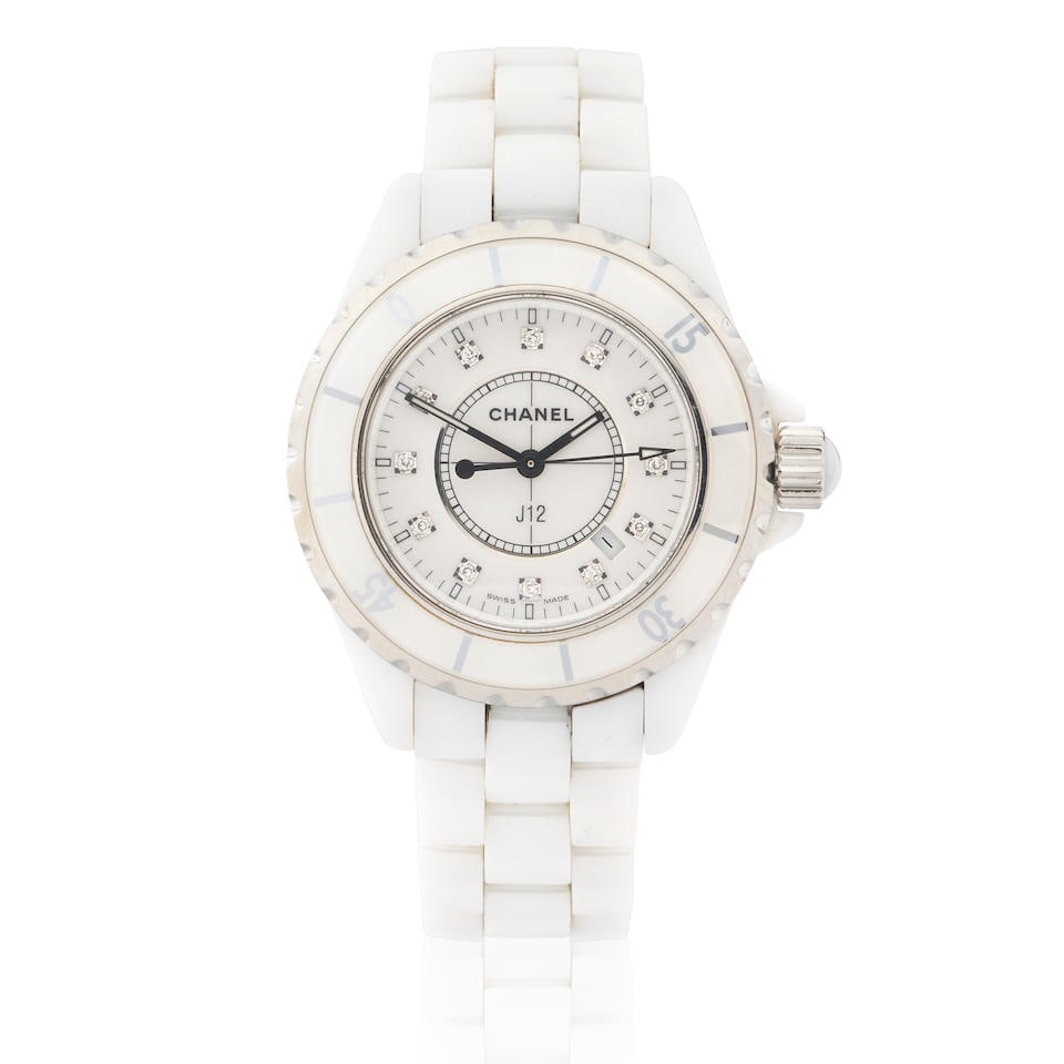 Chanel. A lady's white ceramic and stainless steel quartz calendar bracelet watch with diamond s...: Chanel. A lady's white ceramic and stainless steel quartz calendar bracelet watch with diamond set dial Model: J12 Date: Circa 2010 Movement: 7-jewel ETA Cal.056.612 quartz Dial: White, applied diamon