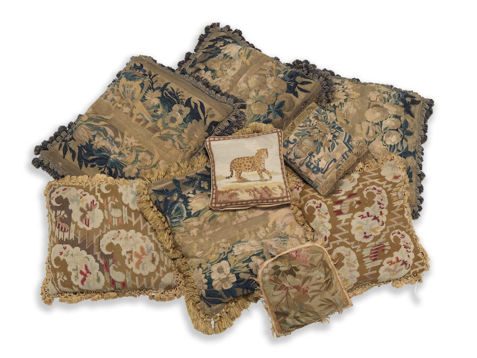 A group of 17th Century Flemish tapestry border fragments made up as cushions (9) (1 of 3)