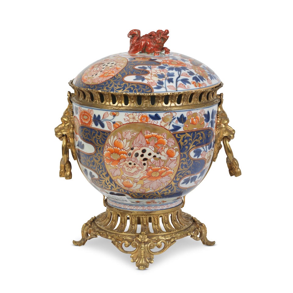 A French gilt bronze mounted Japanese Imari porcelain bowl and cover the porcelain probably Mei...: A French gilt bronze mounted Japanese Imari porcelain bowl and cover the porcelain probably Meiji period, the mounts probably early 20th century the body and domed dover decorated in underglaze blue a