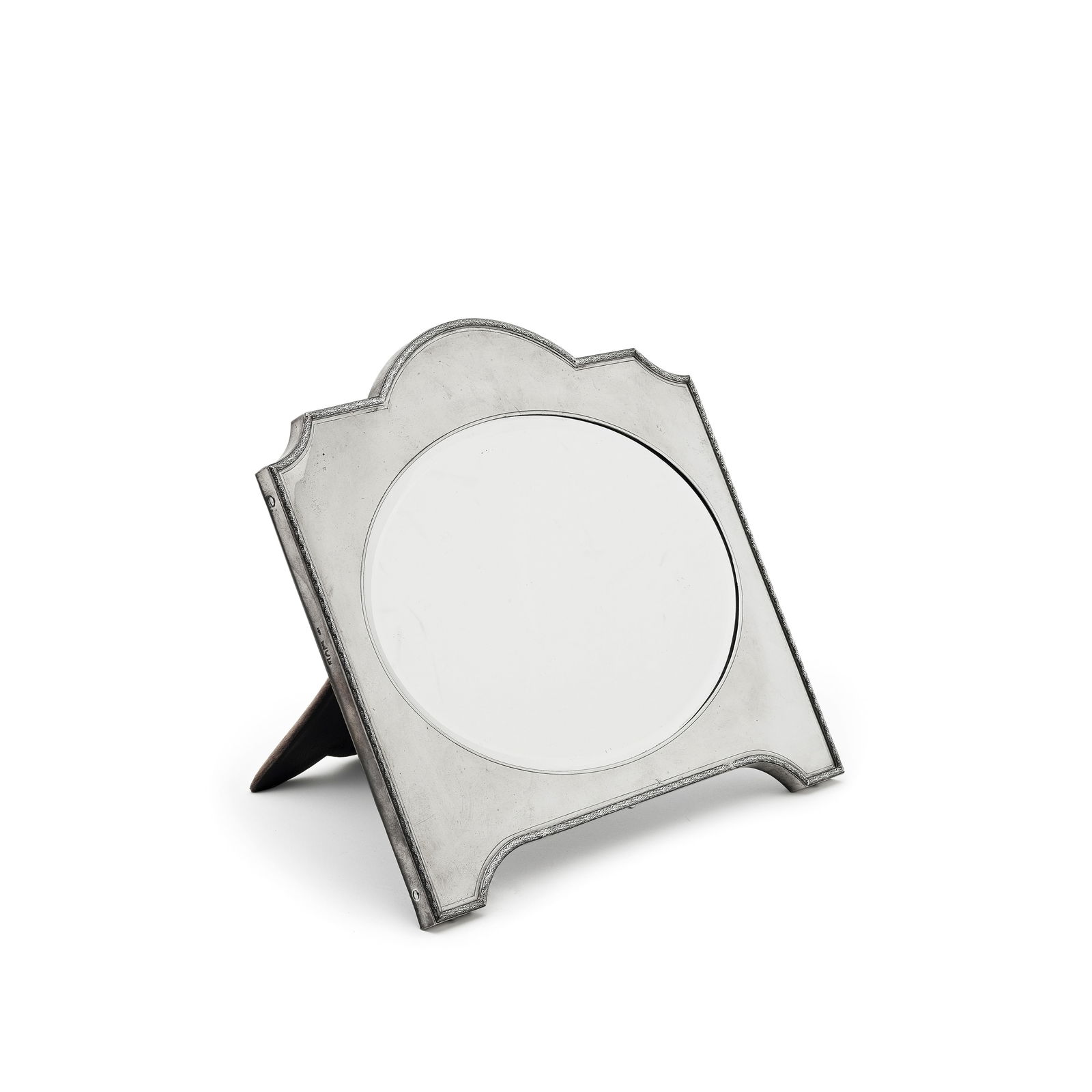A silver table mirror William Frederick Wright, London 1912: A silver table mirror William Frederick Wright, London 1912 Rectangular with shaped arched top and applied border, the oval aperture with bevelled mirror, the material covered back with easel, height