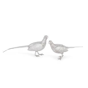 A pair of silver pheasant table ornaments Richard Comyns, London 1967 (2): A pair of silver pheasant table ornaments Richard Comyns, London 1967 Realistically modelled as a cock and hen with feather-effect chasing, length 34.5cm and 22.5cm, weight 38oz. (2)