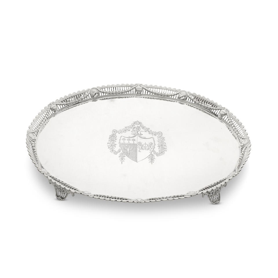 A good George III silver galleried salver Richard Carter, Daniel Smith and Robert Sharp, London ...: A good George III silver galleried salver Richard Carter, Daniel Smith and Robert Sharp, London 1778 Oval form with a raised open-work cast border with wave edge, raised swags over classical urn moti