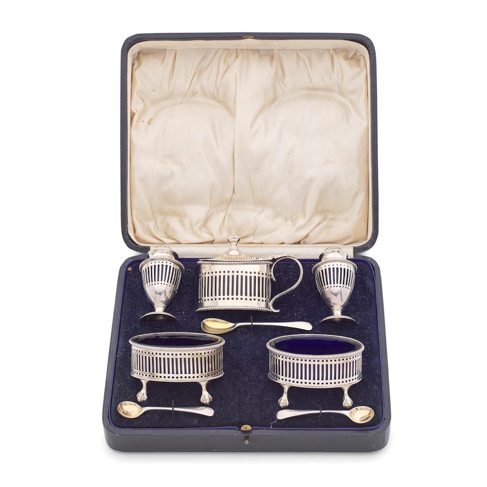 A cased silver five-piece condiment set R Comyns, London 1926 and Charles & Richard Comyns, Lond...: A cased silver five-piece condiment set R Comyns, London 1926 and Charles & Richard Comyns, London 1924 and 1925 In the 18th century manner, oval form with bead rims and pierced sides with dots and sl