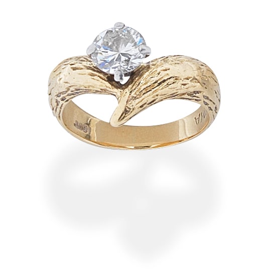 GRIMA: DIAMOND RING: GRIMA: DIAMOND RING The brilliant-cut diamond sitting atop a textured, cross-over band, diamond approx. 0.95ct, signed GRIMA, ring size approx. N