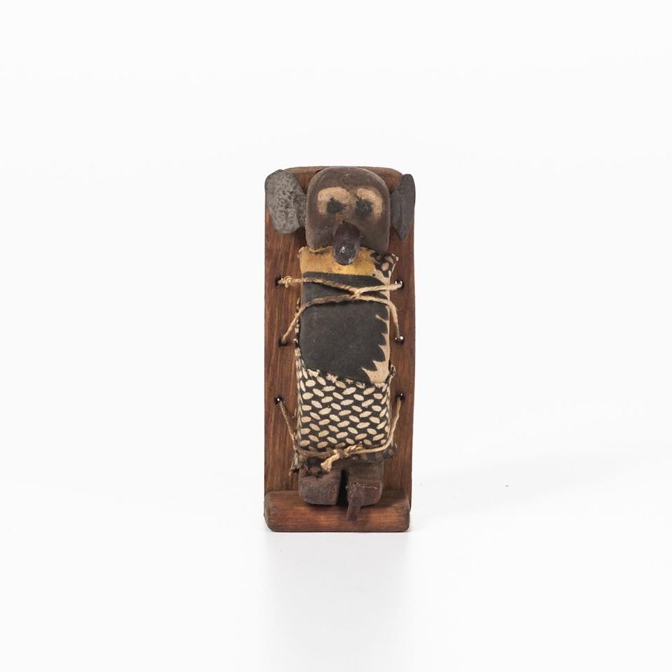 A Southwest carved doll and cradle ht. 3 1/4, wd. 1 1/2 in. (1 of 3)