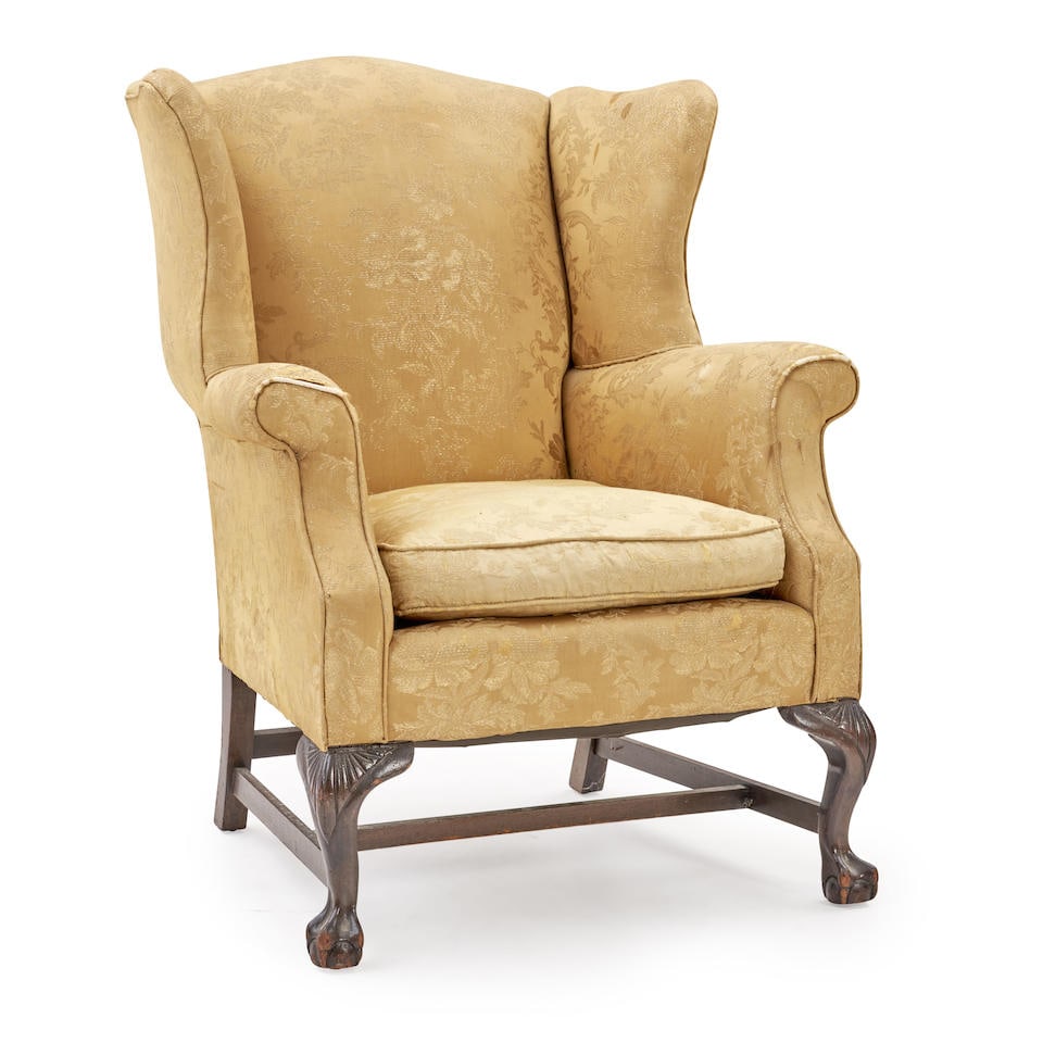 Georgian Wing Chair,: Georgian Wing Chair, golden yellow upholstered body to a mahogany base with carved cabriole legs and ball and claw feet, back ht. 40, seat ht. approx. 20 in. For further information on this lot please
