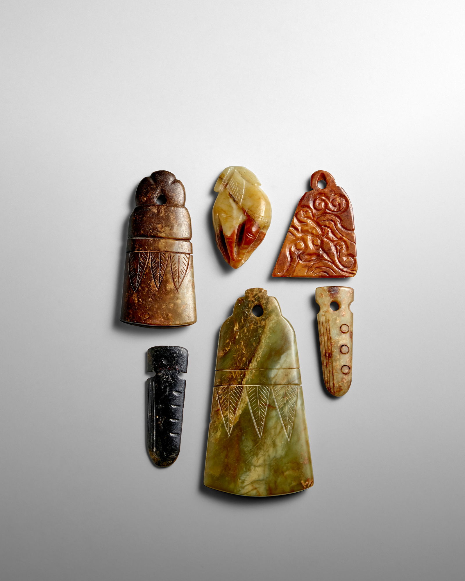 SIX ARCHAISTIC JADE PENDANTS Late Qing Dynasty (1 of 1)