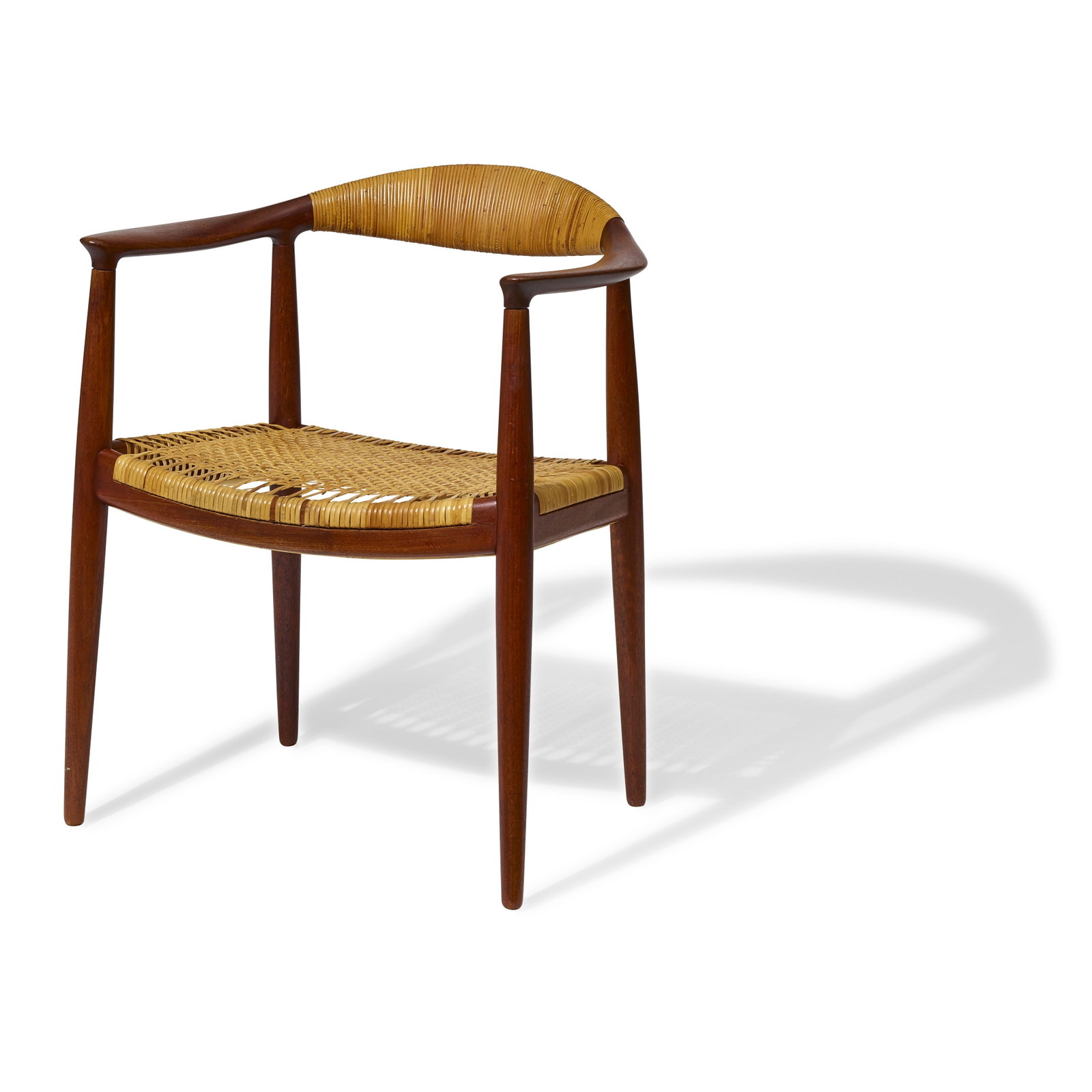 HANS J. WEGNER (1914-2007) The Chaircirca 1949for Johannes Hansen, teak, cane, with branded Joha...: HANS J. WEGNER (1914-2007) The Chair circa 1949 for Johannes Hansen, teak, cane, with branded Johannes Hansen mark on underside height 29 3/4in (76cm); width 24 3/4in (63cm); depth 21in (53.5cm) Footn
